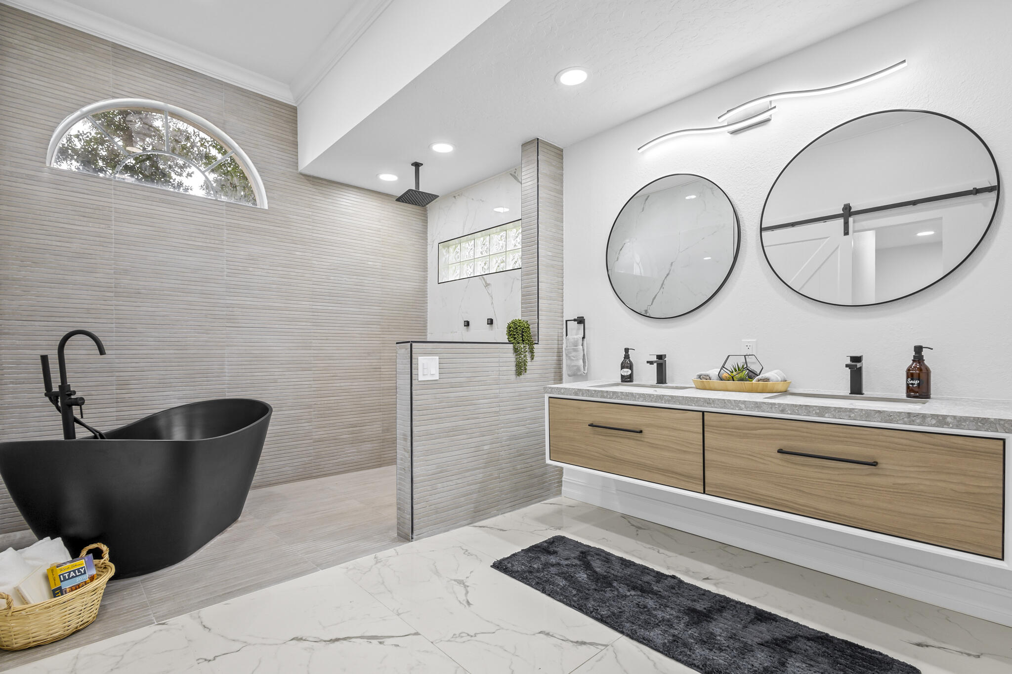 1695 Rustic Way Melbourne, FL 32935 - Photo 8 of 24 a spacious bathroom with a double vanity sink a mirror and a