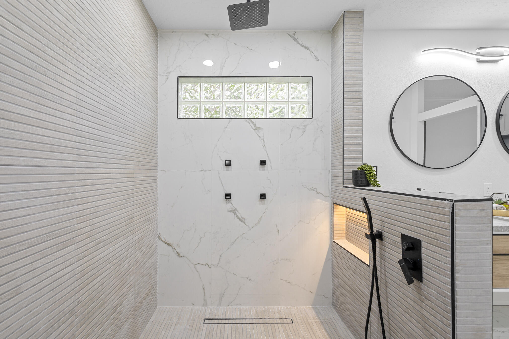 1695 Rustic Way Melbourne, FL 32935 - Photo 10 of 24 a bathroom with a sink and a mirror