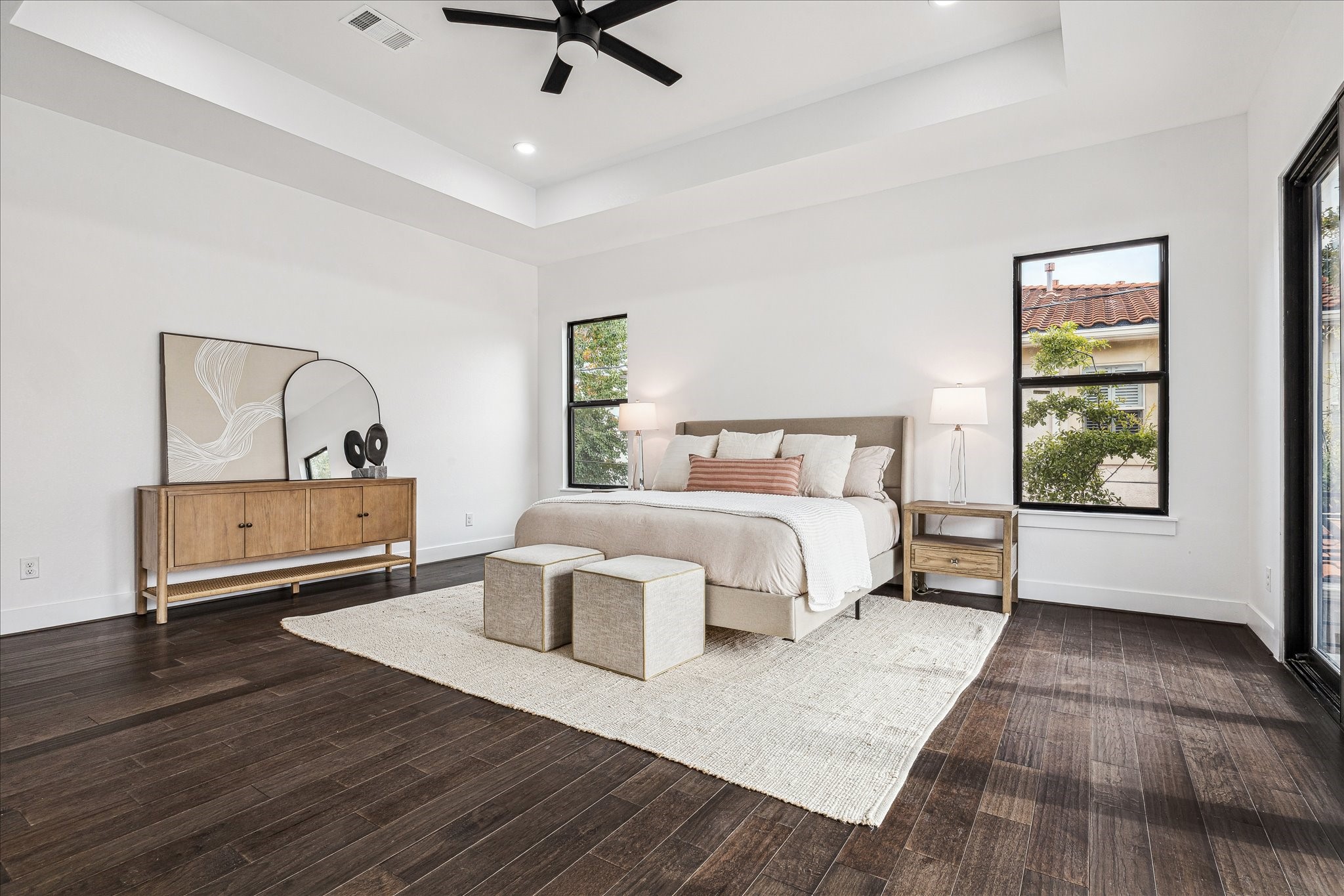3209 McCulloch Circle Houston, TX 77056 - Photo 22 of 33 This view captures the room’s elegant trayed ceiling and the light that streams through, creating a bright, airy, and serene retreat.
