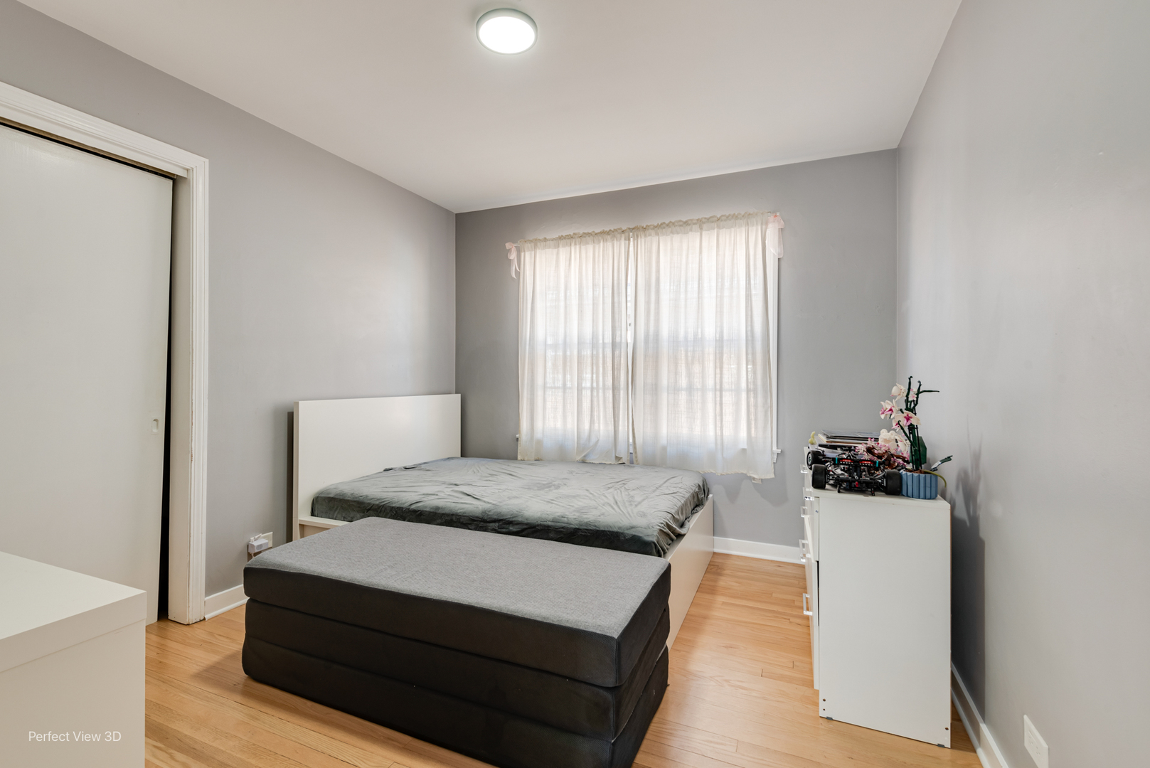 8152 North Ozark Avenue Niles, IL 60714 - Photo 12 of 28 a bedroom with a bed and window