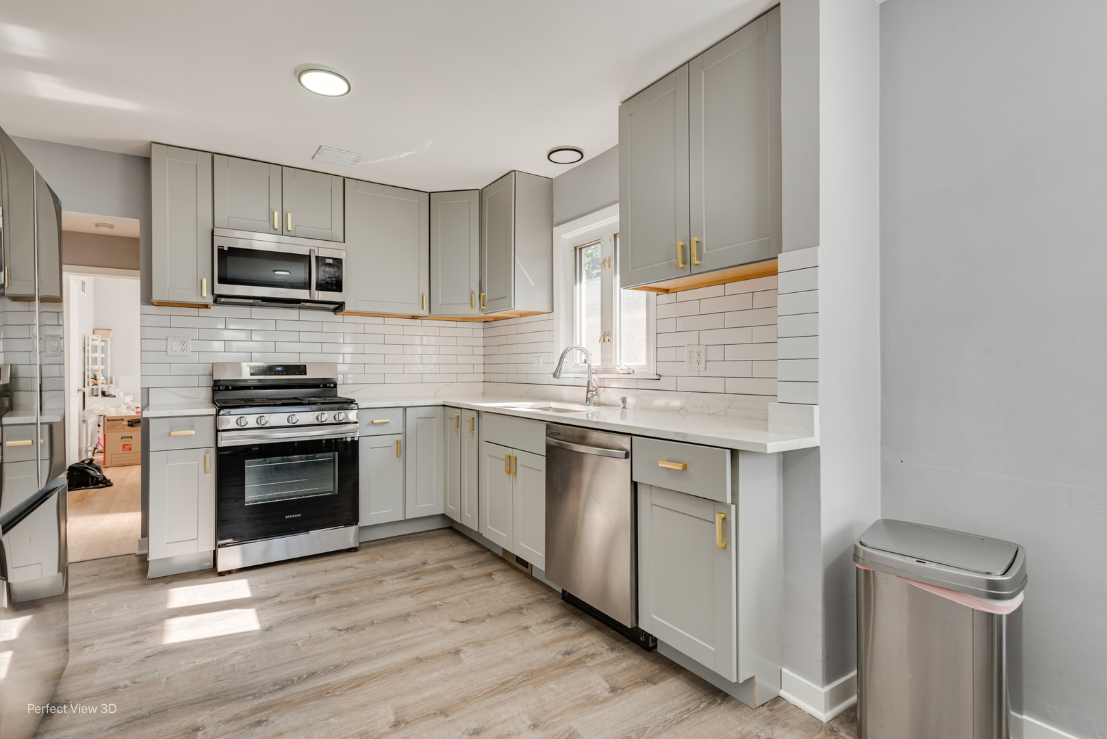8152 North Ozark Avenue Niles, IL 60714 - Photo 6 of 28 a kitchen with stainless steel appliances a stove sink microwave and cabinets