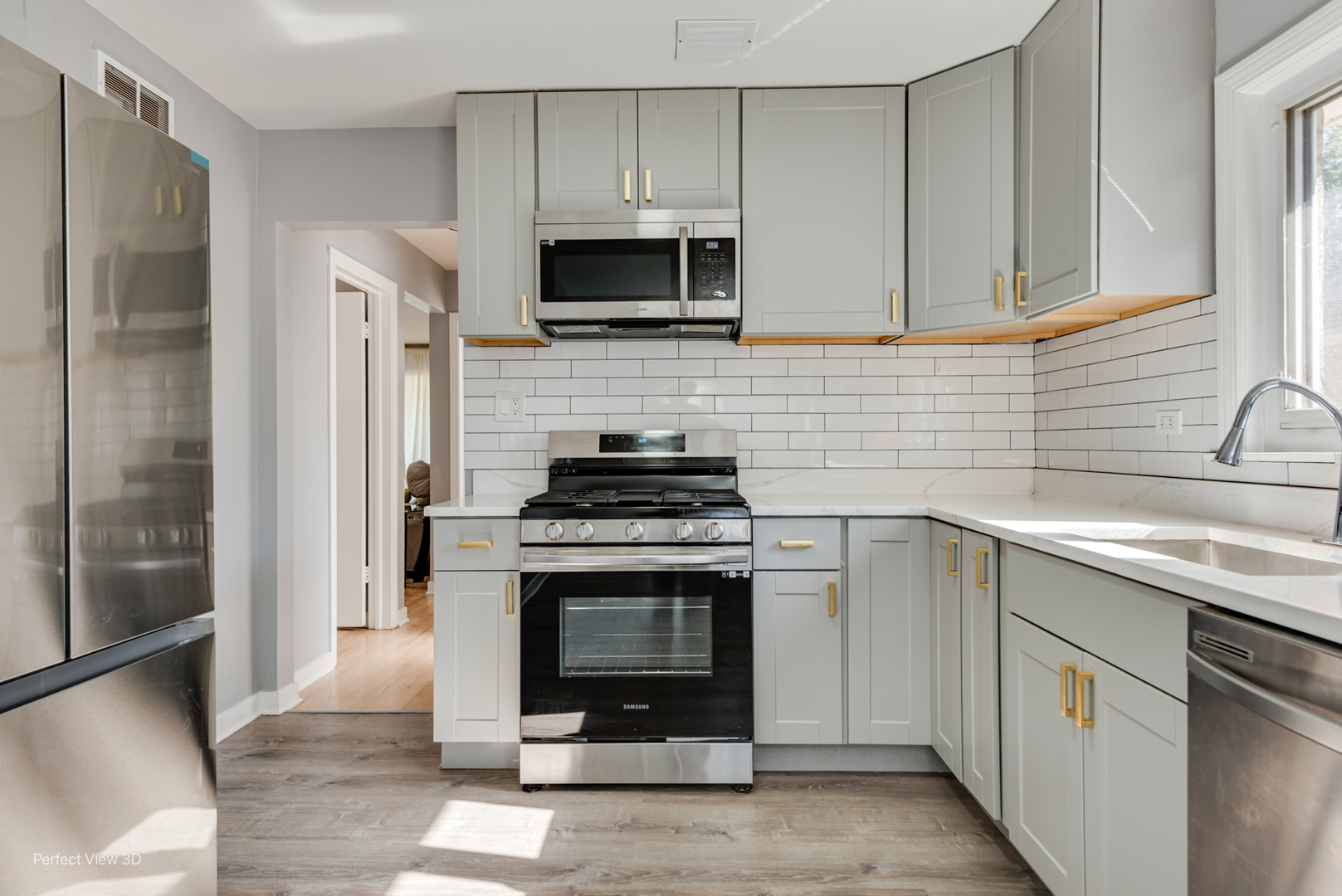 8152 North Ozark Avenue Niles, IL 60714 - Photo 7 of 28 a kitchen with stainless steel appliances a stove a sink and a microwave