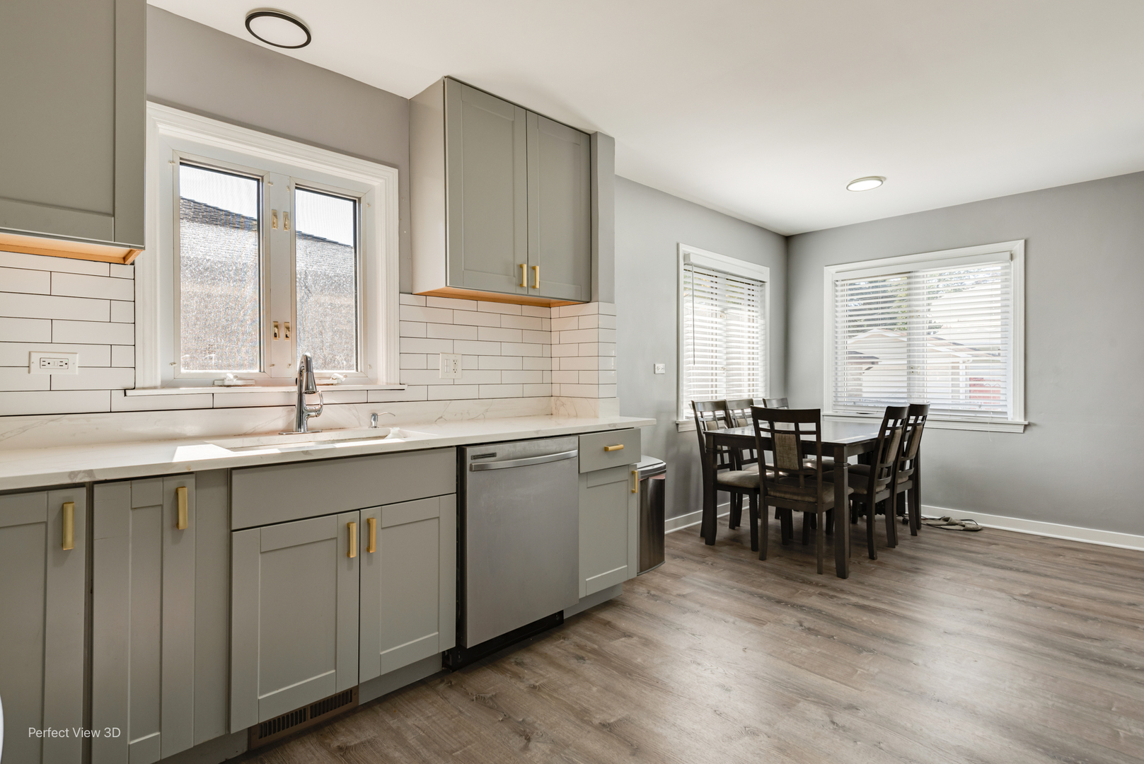 8152 North Ozark Avenue Niles, IL 60714 - Photo 9 of 28 a kitchen with sink dining table and chairs