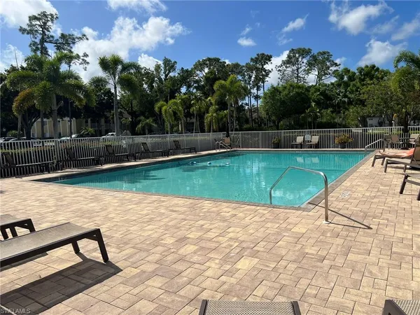 a view of a swimming pool with a patio