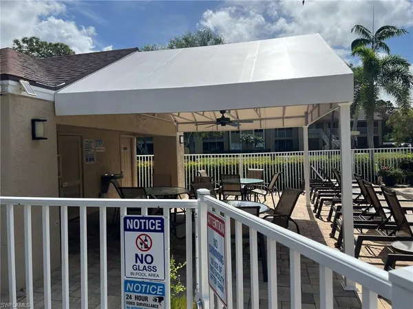 a view of a chairs and table in front of the house