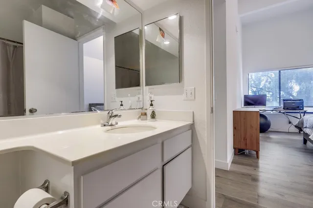 a en suite bathroom with a sink and a mirror