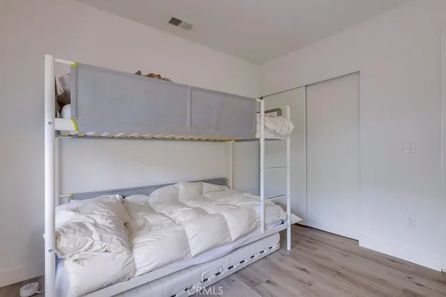 a bedroom with a bed and a walk in closet