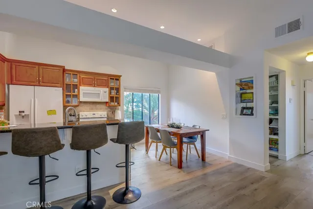 a view of a dining room with furniture and window