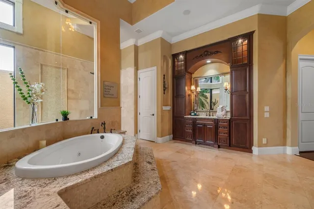 a room with lots of furniture and a book shelf