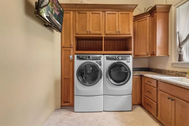 a dining room with furniture and a potted plant