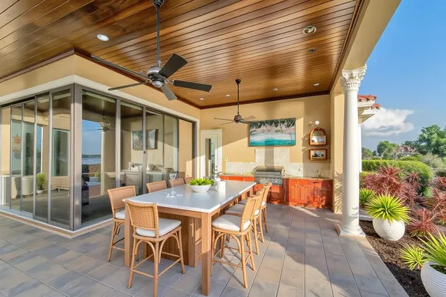a front view of a house with swimming pool and sitting area