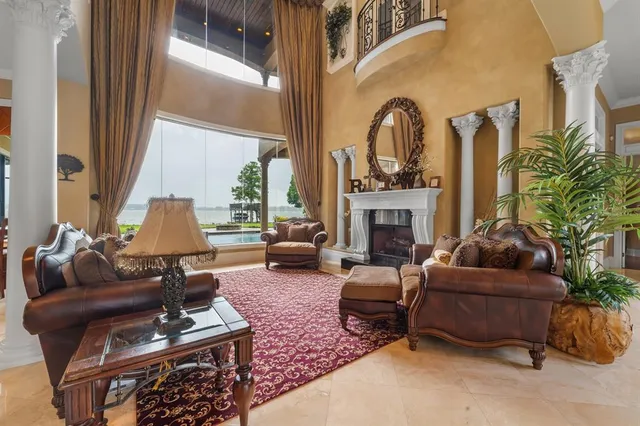 a living room with furniture and a fireplace