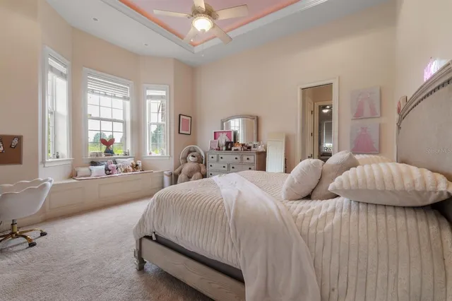 a bathroom with a bathtub a sink a vanity and a mirror