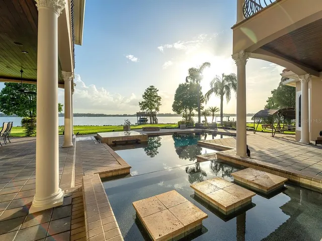a view of a patio with chairs and table
