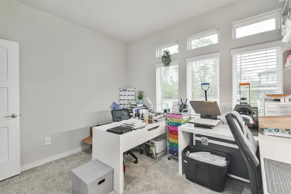 a workspace with furniture and a window