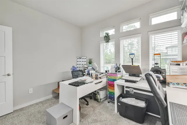 a workspace with furniture and a window