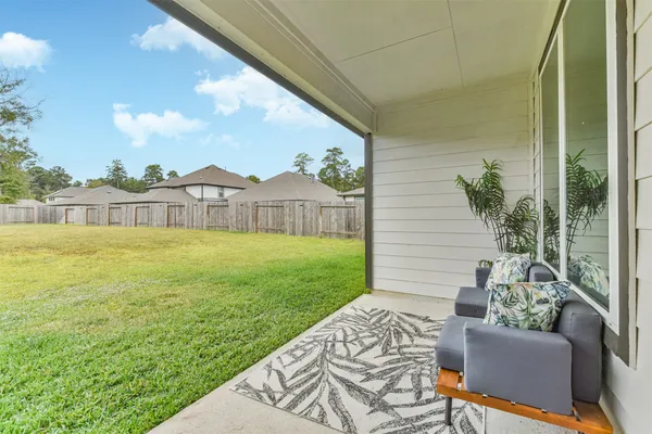 a view of house with backyard outdoor seating and mountain view