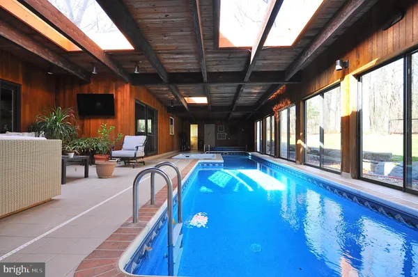 a view of a patio with swimming pool