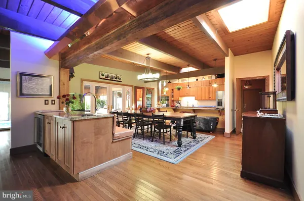 a kitchen with stainless steel appliances granite countertop a stove and cabinets