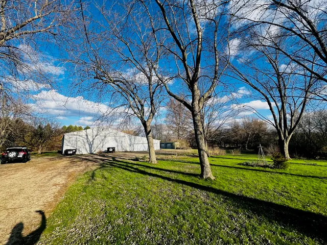 a view of a park with large trees