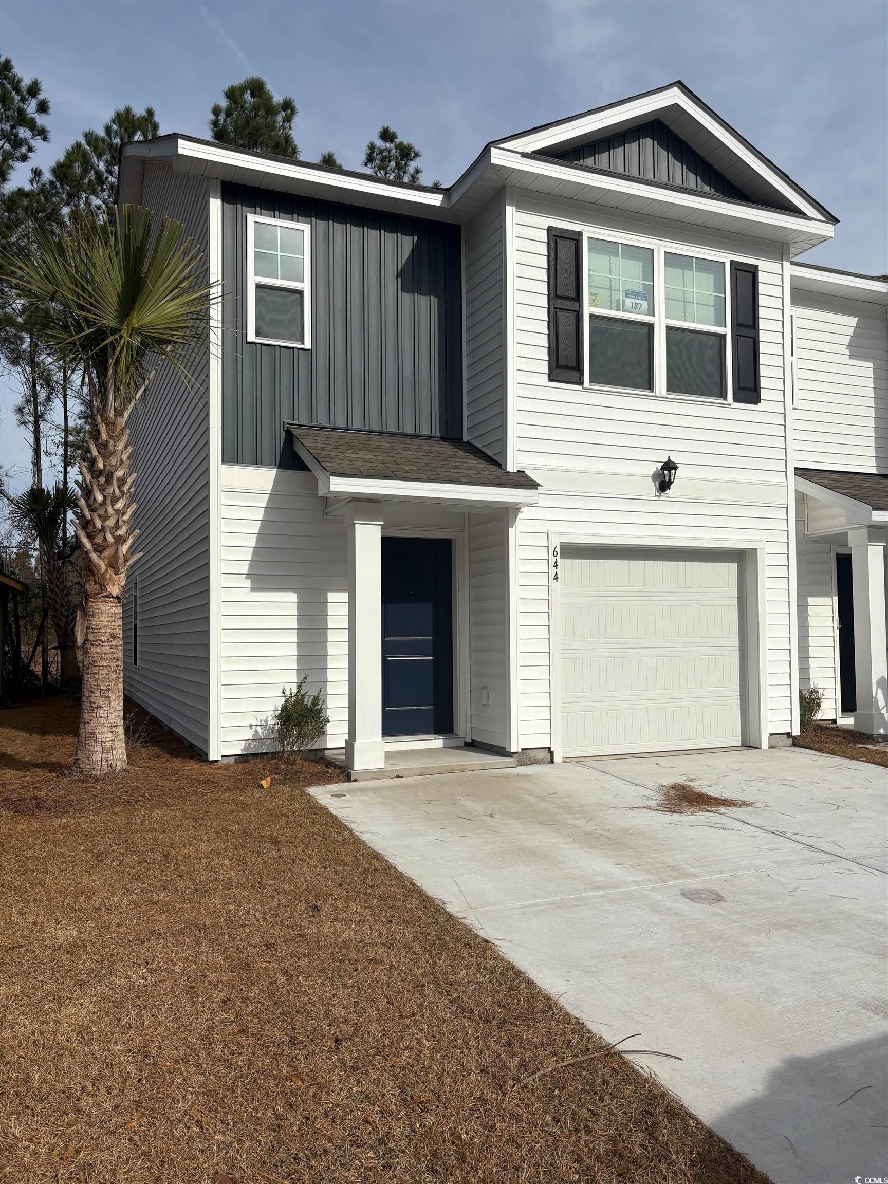 644 Golden Resin Road, Unit LOT 187 Conway, SC 29526 - Photo 1 of 40 View of front of house with board and batten siding, driveway, and a garage