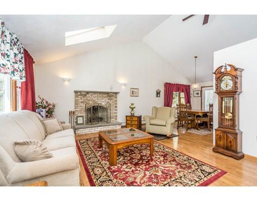17 Jennings Road Billerica, MA 01862 - Photo 4 of 29 a living room with furniture wooden floor and a fireplace