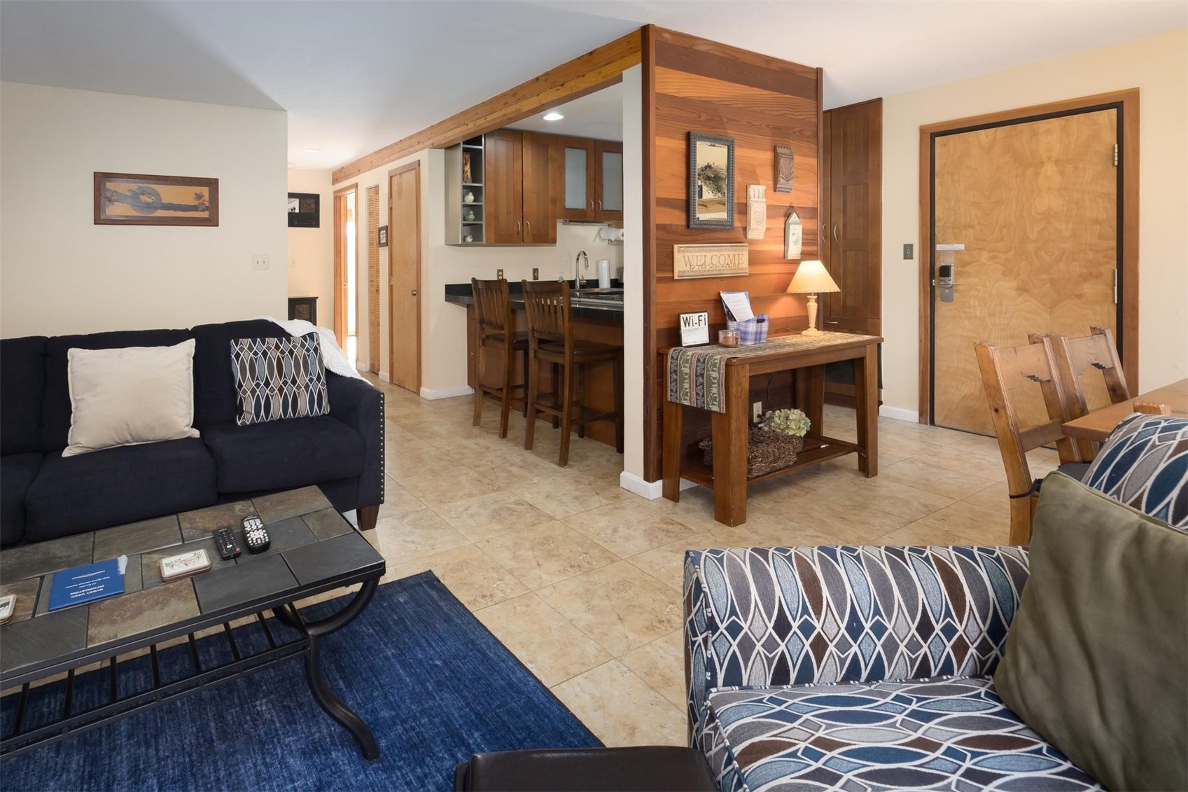 91100 Ryan Gulch Road, Unit 91105 Silverthorne, CO 80498 - Photo 15 of 49 a living room with furniture and a large window