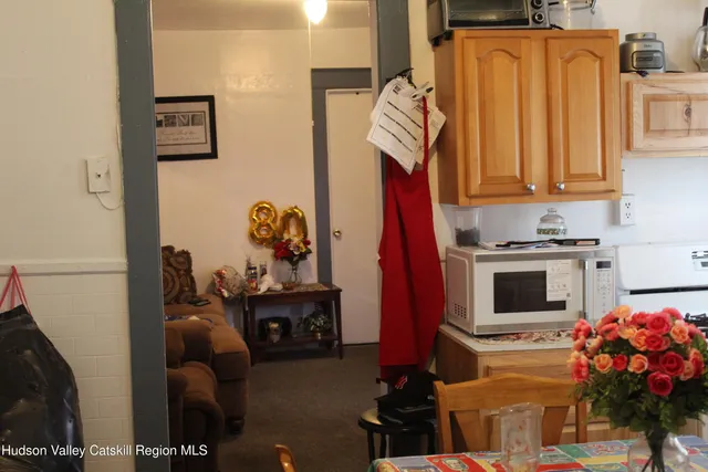 a bedroom with a bed and dresser