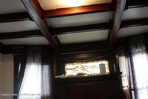 a bedroom with a bed and hallway