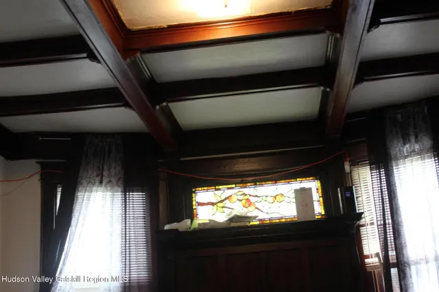 a bedroom with a bed and hallway