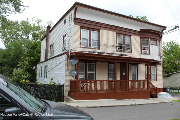 a front view of a house with a garage