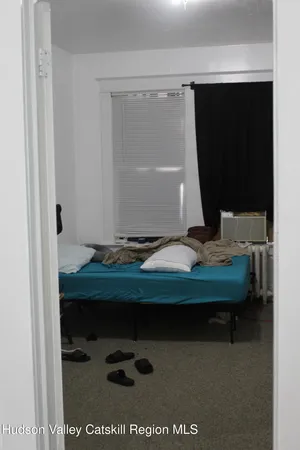 a room with a table and a potted plant