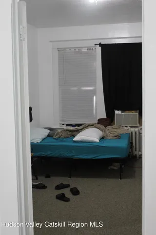 a room with a table and a potted plant