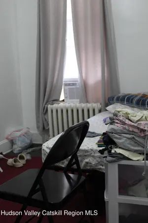 a view of a dining table and chairs