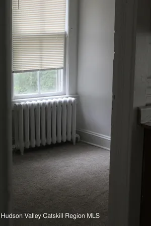 a view of a room with a window