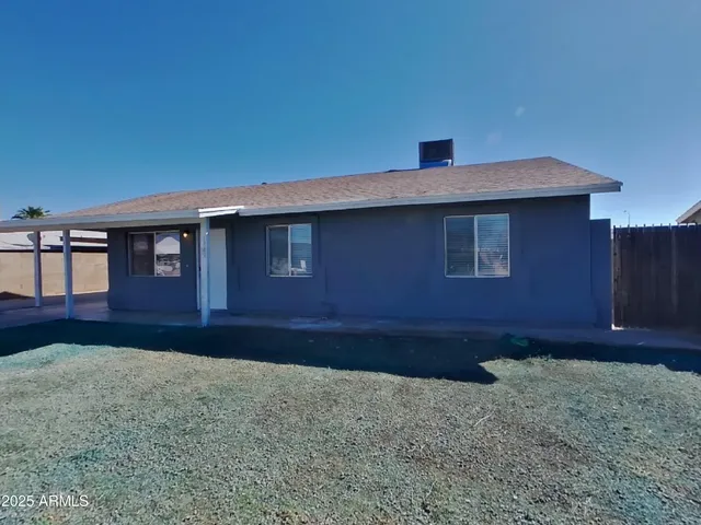 a house view with a backyard space