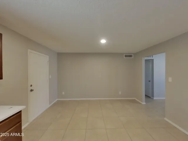 a kitchen with stainless steel appliances a refrigerator and a microwave