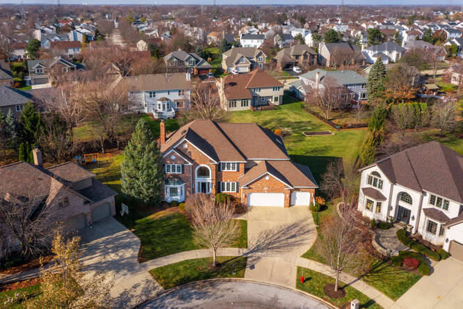 an aerial view of a house with a garden