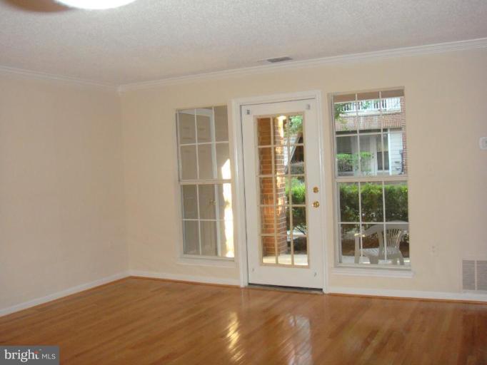 21001 Timber Ridge Terrace, Unit 104 Ashburn, VA 20147 - Photo 1 of 6 Living Room