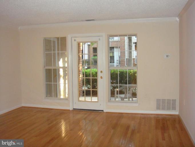 21001 Timber Ridge Terrace, Unit 104 Ashburn, VA 20147 - Photo 5 of 6 Living Room #2