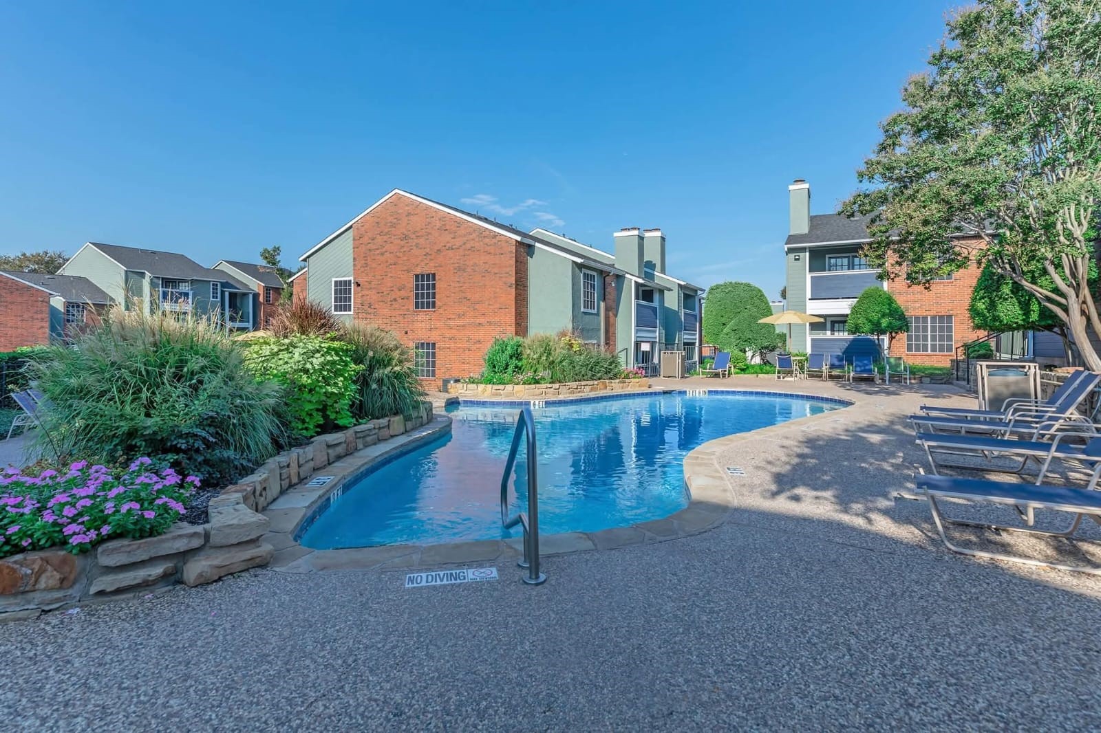 3737 Timberglen Road, Unit 909 Dallas, TX 75287 - Photo 18 of 19 a house view with a garden space