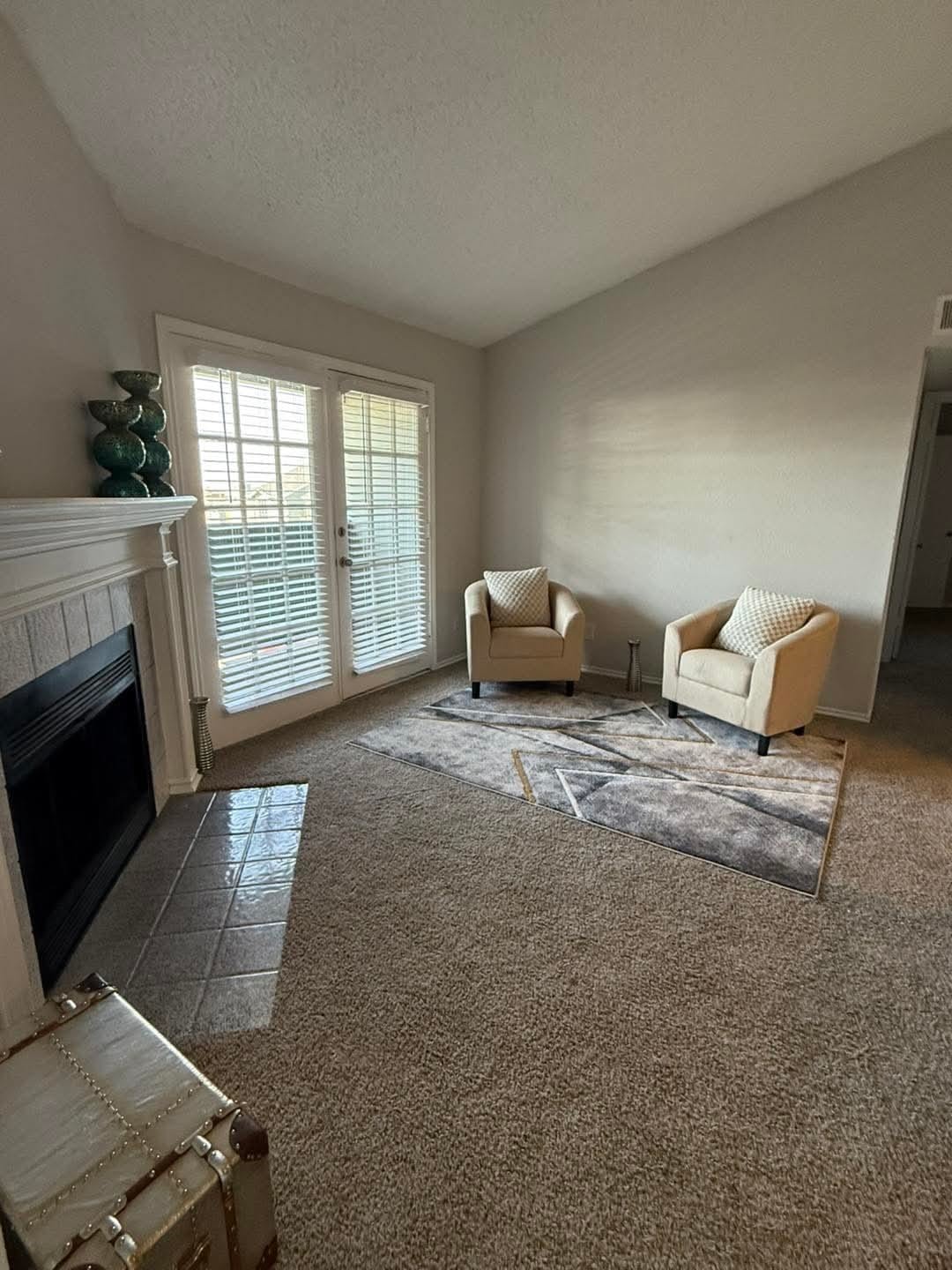 3737 Timberglen Road, Unit 909 Dallas, TX 75287 - Photo 2 of 19 a living room with furniture and a fireplace