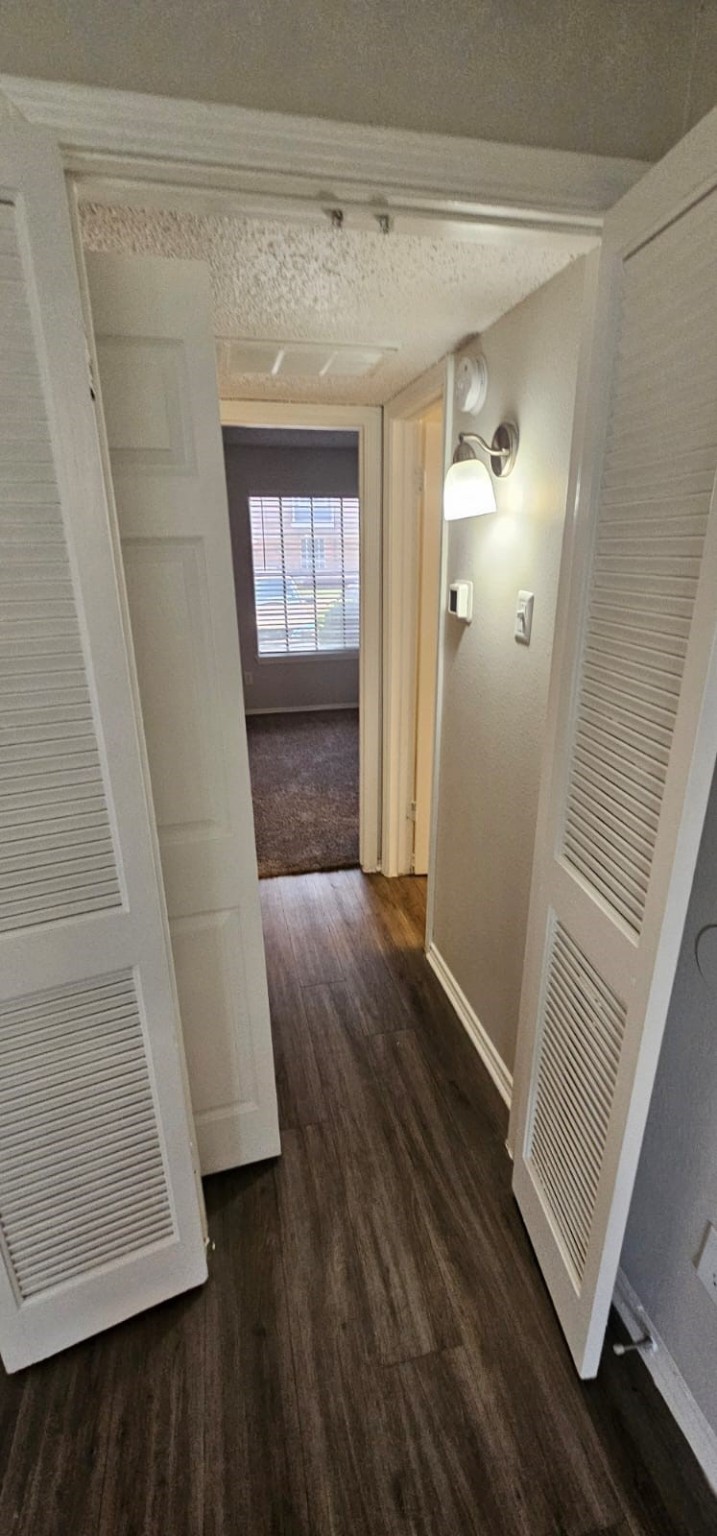 3737 Timberglen Road, Unit 909 Dallas, TX 75287 - Photo 7 of 19 a view of entryway with wooden floor