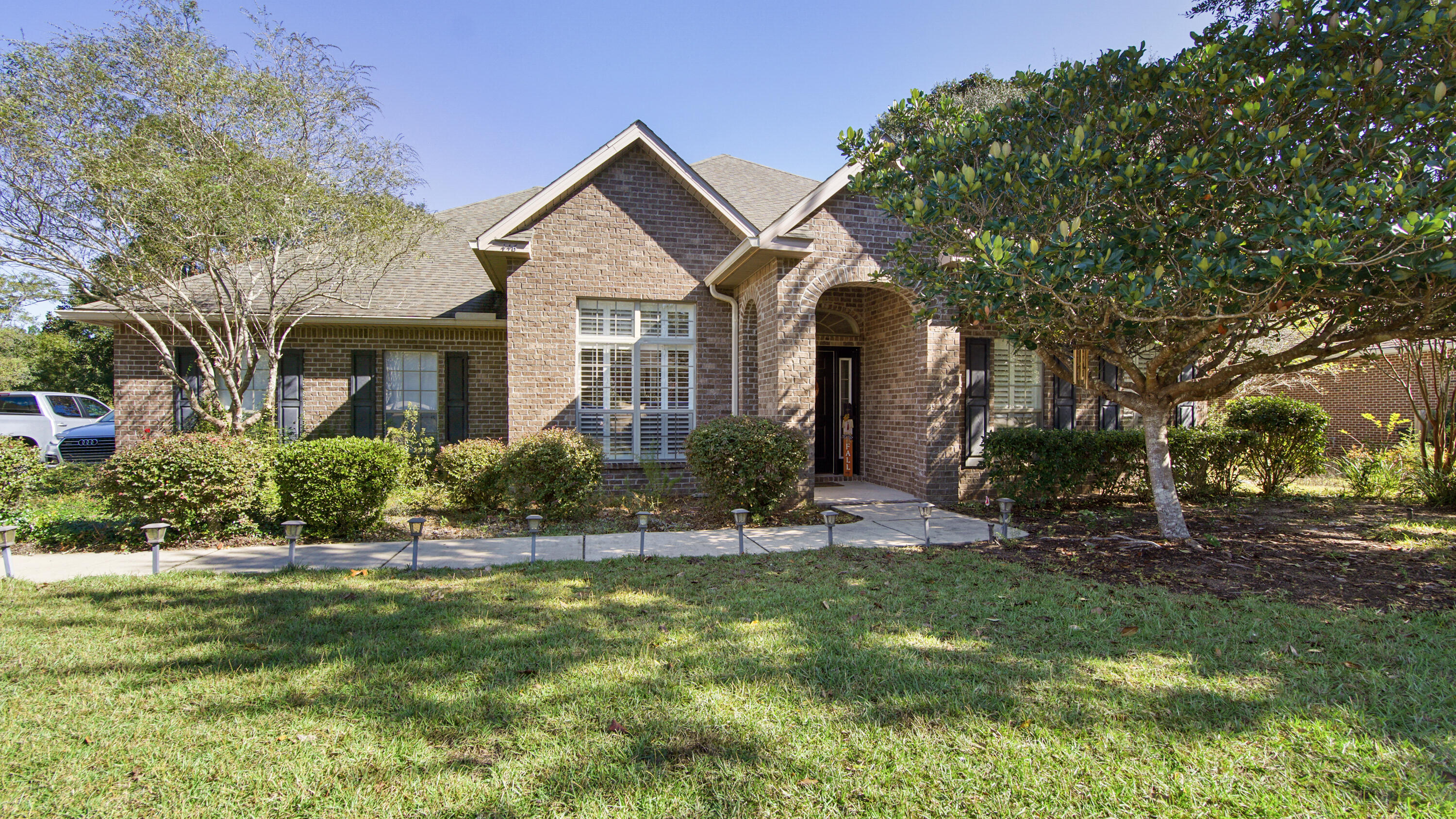 a front view of a house with a yard