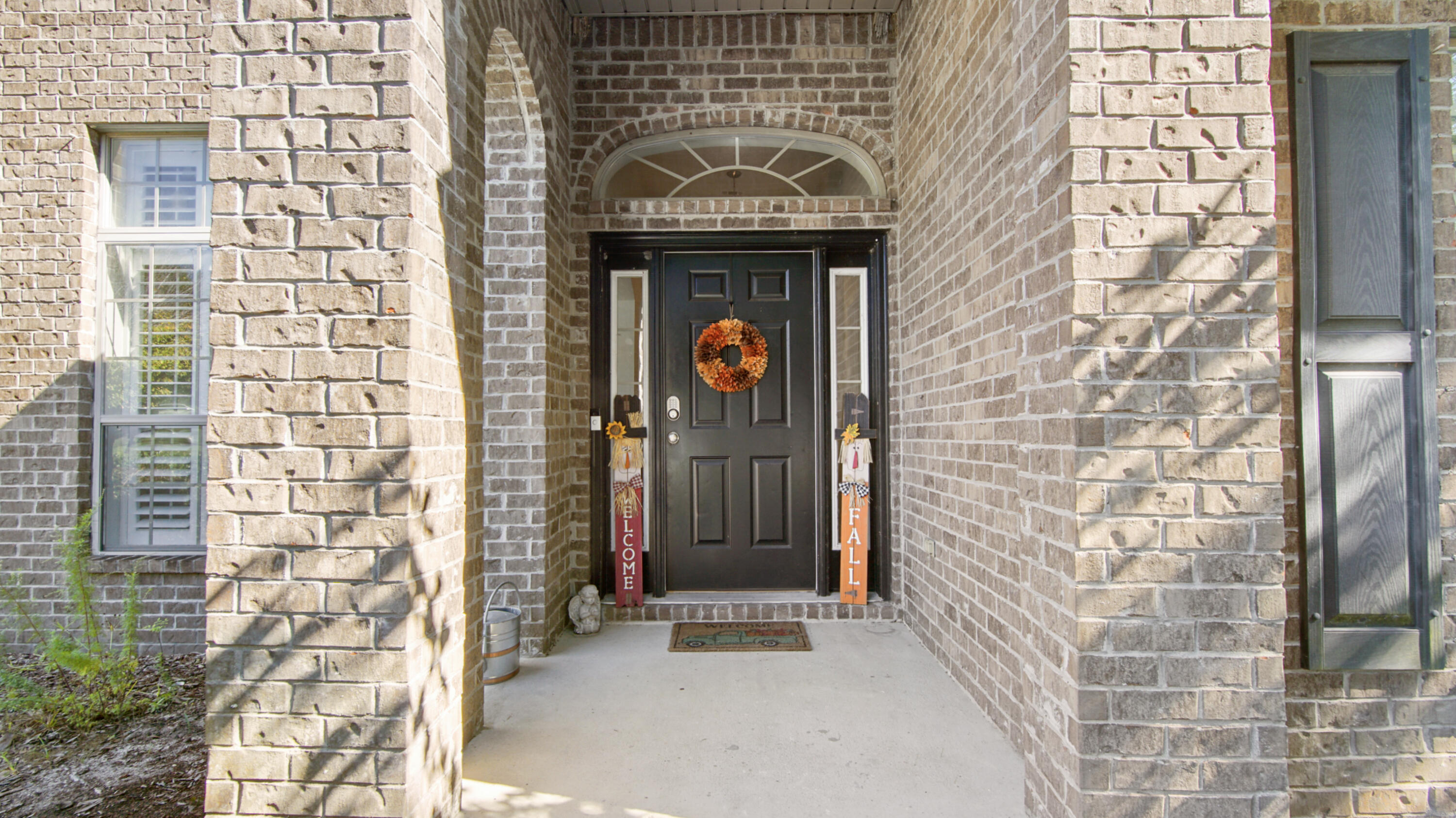 446 Mango Lane Freeport, FL 32439 - Photo 2 of 74 a front view of a building with an entrance