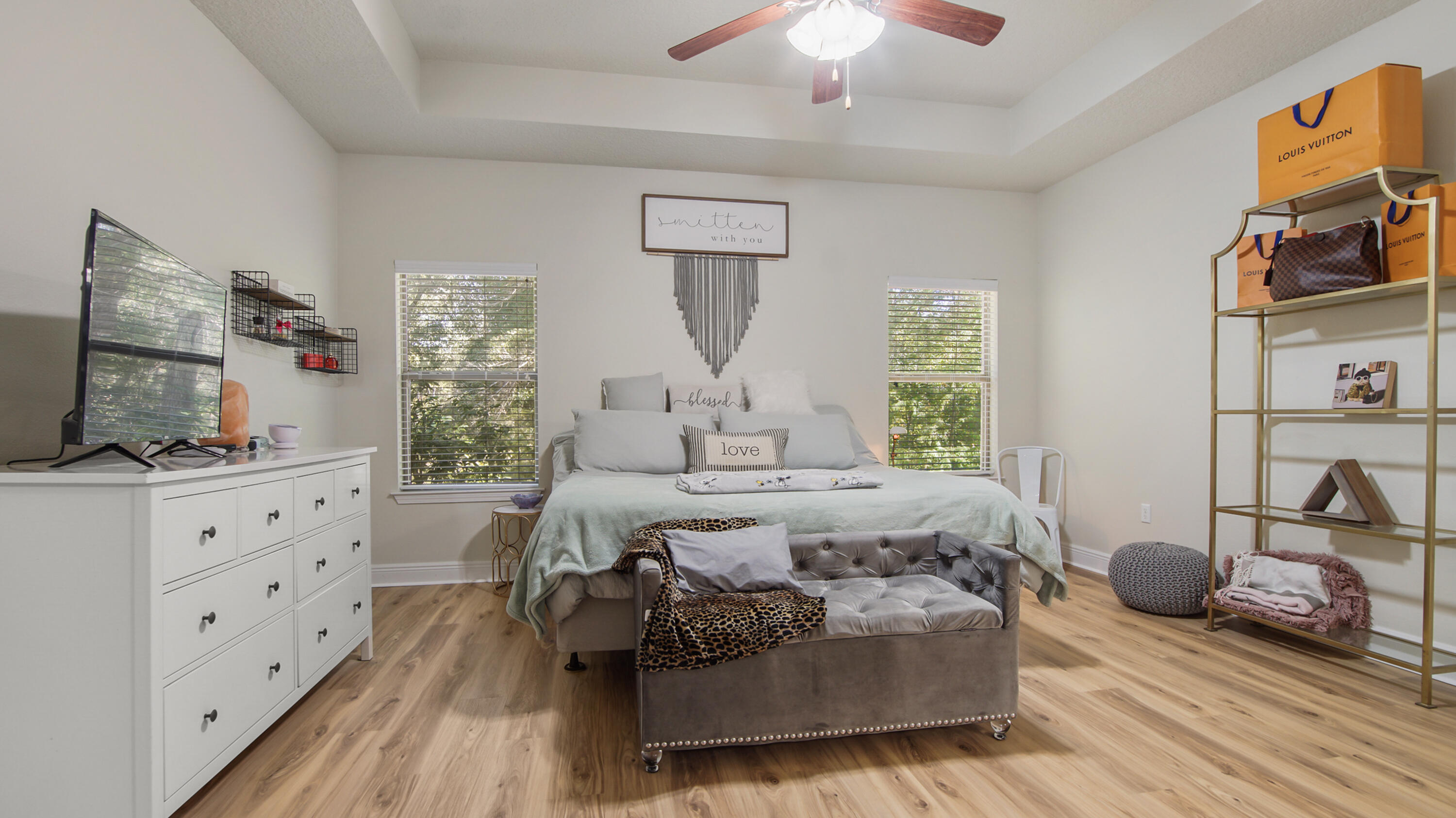 446 Mango Lane Freeport, FL 32439 - Photo 32 of 73 a bedroom with furniture and a flat screen tv