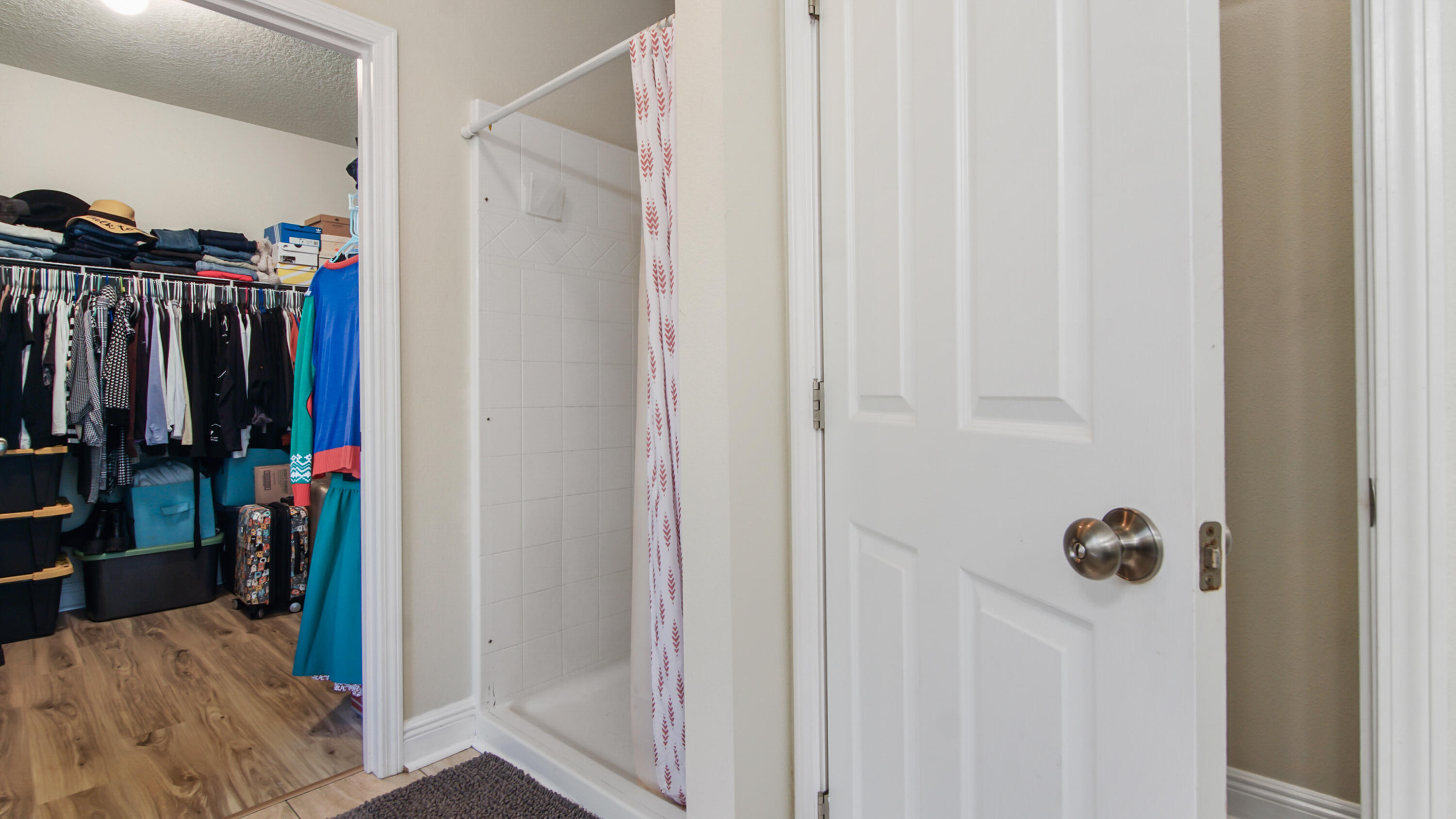 446 Mango Lane Freeport, FL 32439 - Photo 35 of 73 a view of walk in closet with clothes and shoes