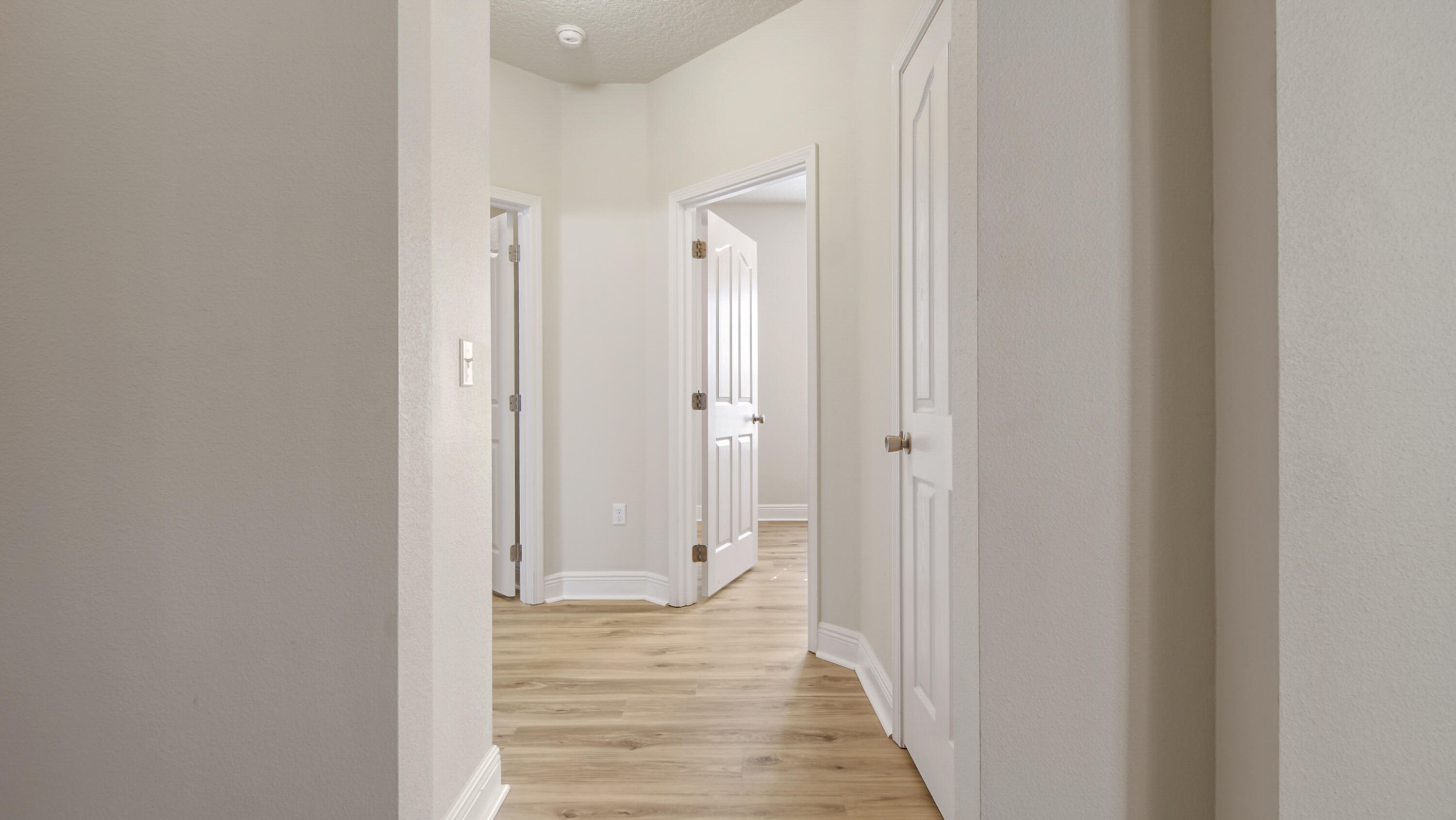 446 Mango Lane Freeport, FL 32439 - Photo 72 of 73 a view of a hallway with wooden floor