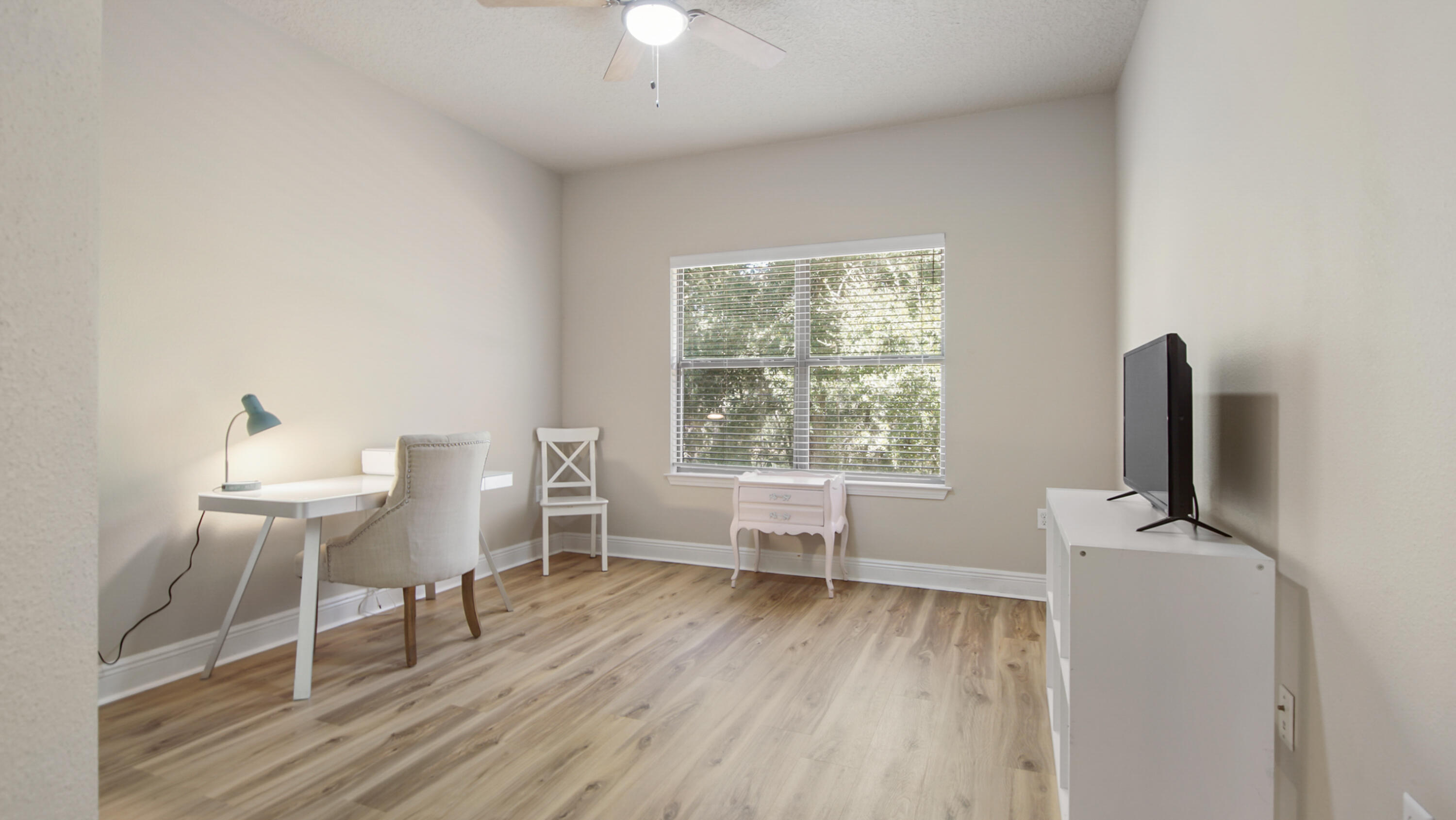 446 Mango Lane Freeport, FL 32439 - Photo 39 of 73 a living room with furniture a flat screen tv and a window