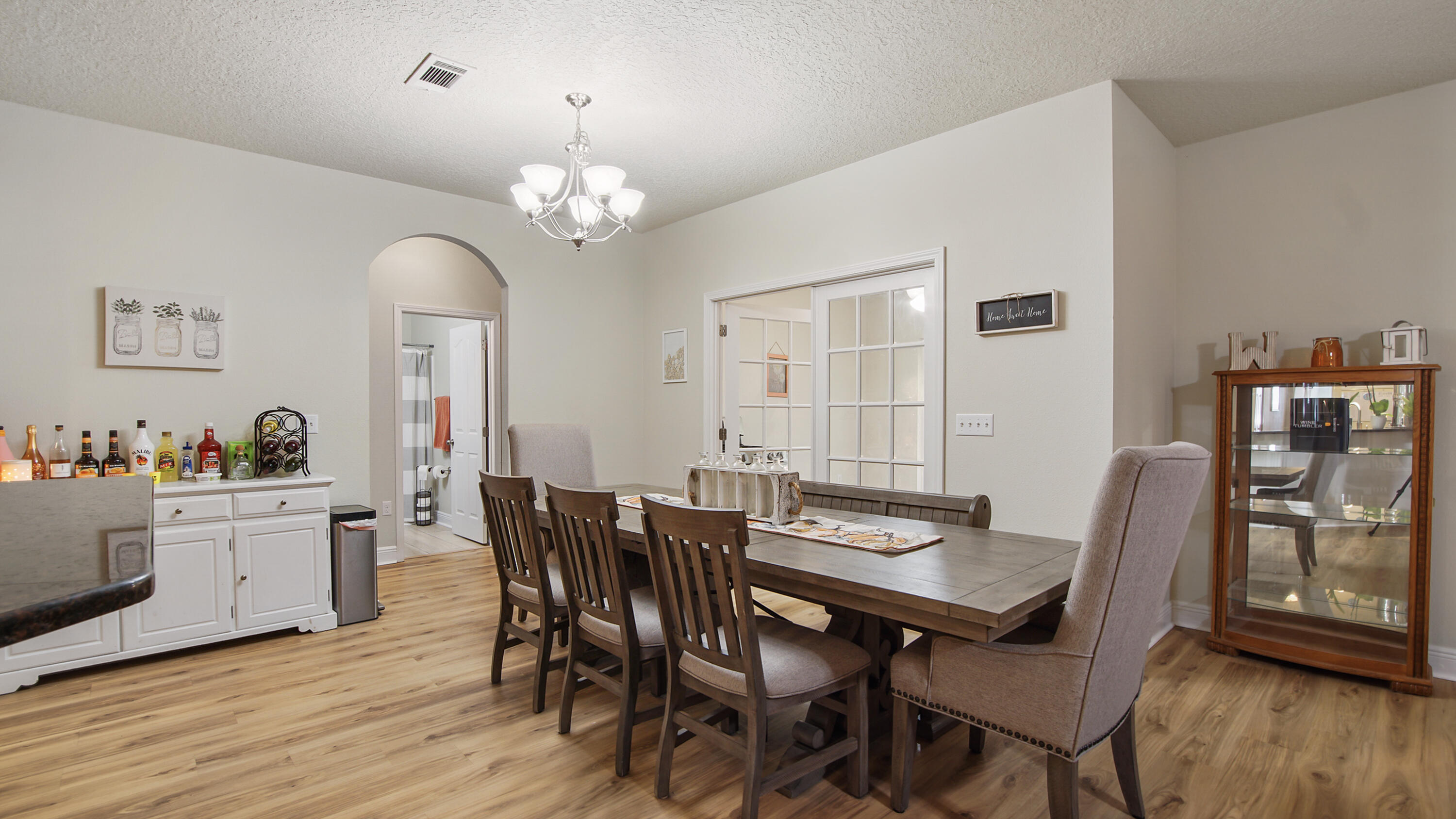 446 Mango Lane Freeport, FL 32439 - Photo 4 of 73 a view of a dining room with furniture window and wooden floor